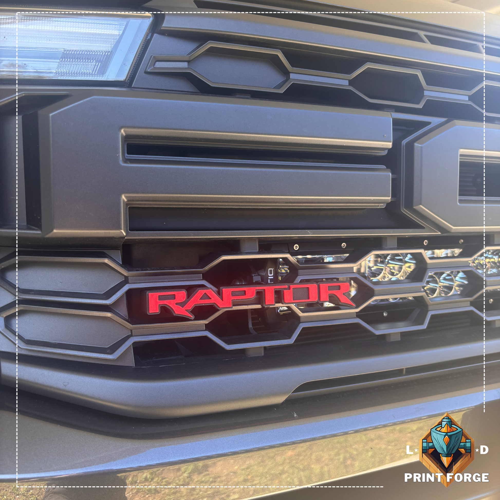 Custom RAPTOR front grille emblem badge installed on grille